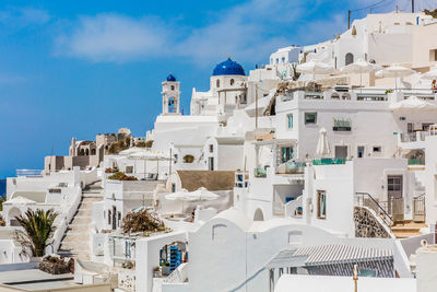 Low angle view of residential buildings against blue sky