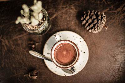 High angle view of coffee cup on table