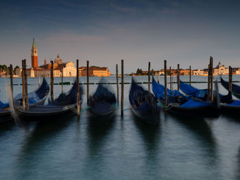 Boats moored in canal