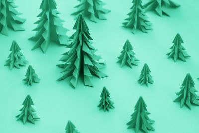 Christmas trees made out of paper. diy origami christmas present. toned into green color