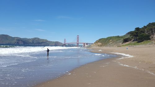 View of suspension bridge on beach