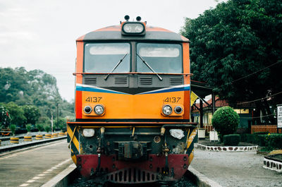 Train on railroad track against sky