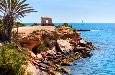 Scenic view of sea against clear blue sky