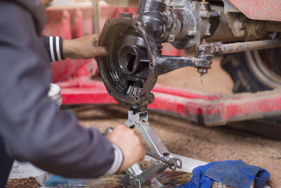 Cropped hands of man working in workshop