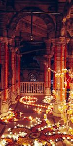 Statue in illuminated temple at night