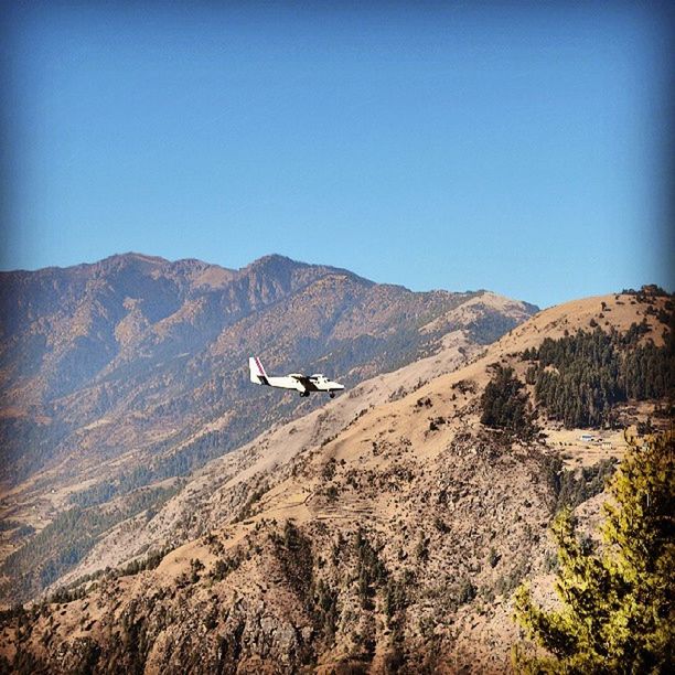 mountain, transportation, mountain range, mode of transport, clear sky, landscape, scenics, tranquil scene, copy space, tranquility, flying, beauty in nature, nature, travel, on the move, blue, journey, non-urban scene, day, mid-air