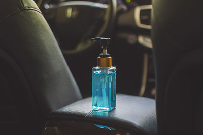 Close-up of wine glass in car