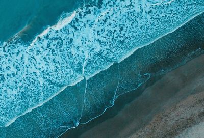 Aerial view of beach against sea