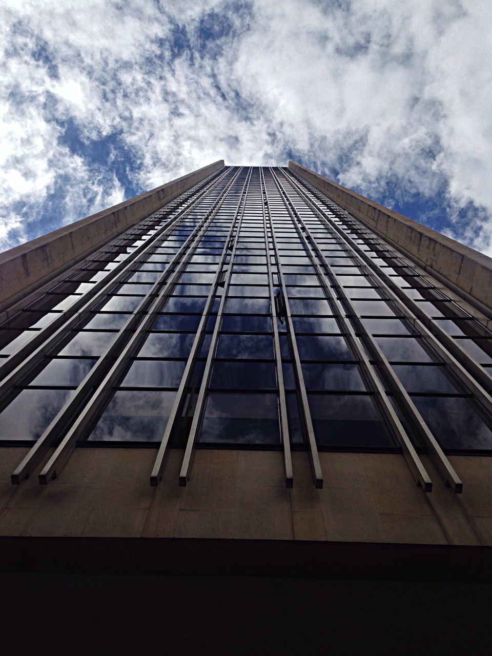 architecture, built structure, low angle view, modern, building exterior, sky, office building, glass - material, skyscraper, tall - high, cloud - sky, city, diminishing perspective, cloud, reflection, building, glass, cloudy, day, tower