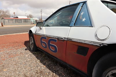 Close-up of car on road