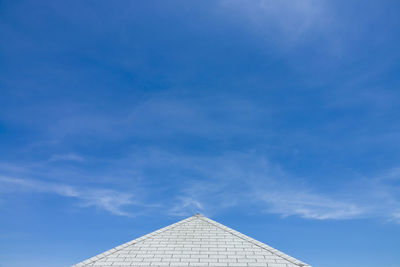 Low angle view of building against blue sky