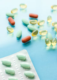 Close-up of pills on blue background