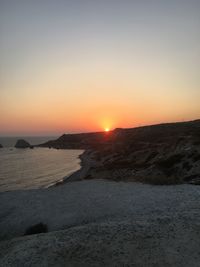 Scenic view of sea against clear sky during sunset