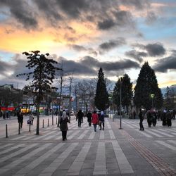 People at cloudy sky