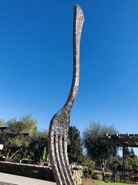 Low angle view of succulent plant against clear blue sky