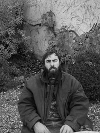 Portrait of young man sitting outdoors