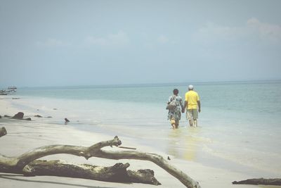 Woman standing on beach