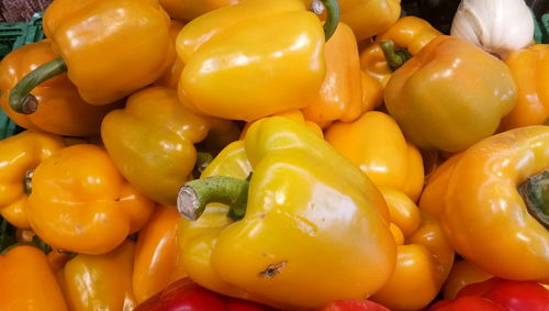 Full frame shot of yellow bell peppers for sale in market