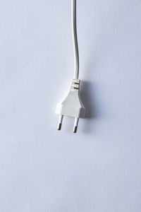 Close-up of electric lamp against white background