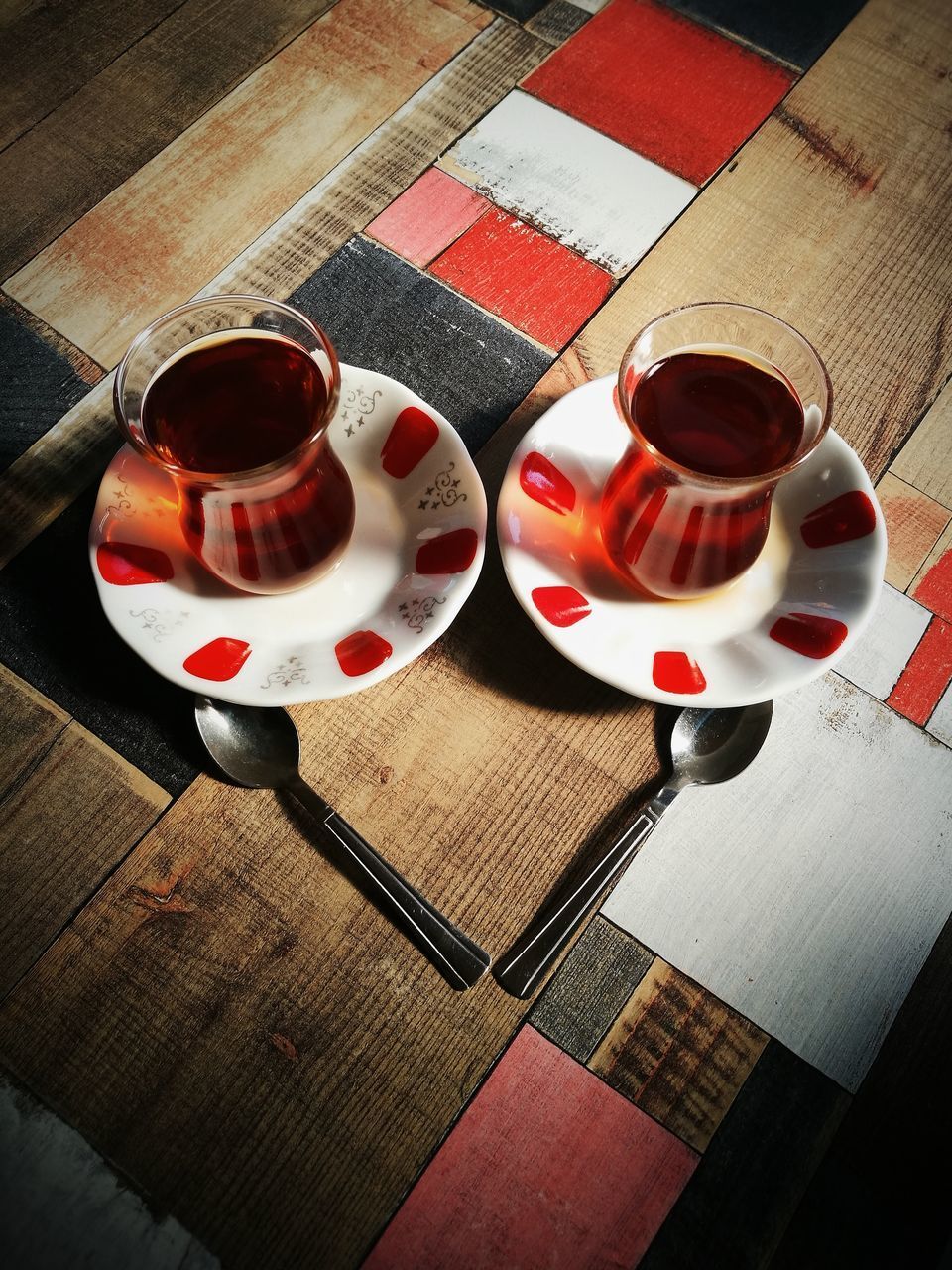 HIGH ANGLE VIEW OF COFFEE CUP ON TABLE AT CAFE