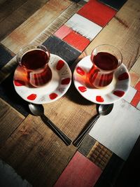 High angle view of coffee cups on table