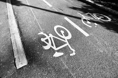 High angle view of bicycle marking on road