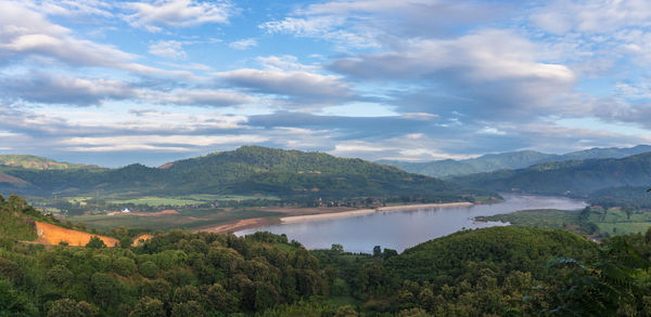 Scenic view of lake and mountains against sky