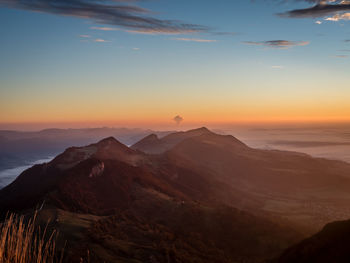 Scenic view of mountains against sky during sunset