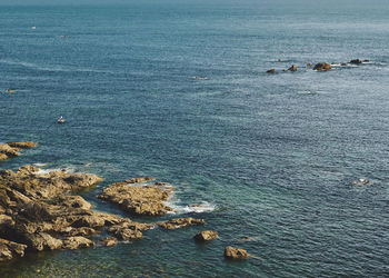 High angle view of rocks on sea shore at lizard point in cornwall, england
