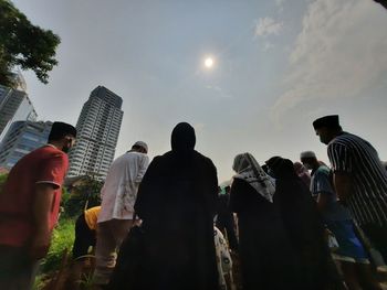 Group of people in front of buildings