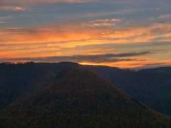 Scenic view of mountains against sky during sunset