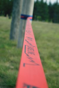 Close-up of text on grass