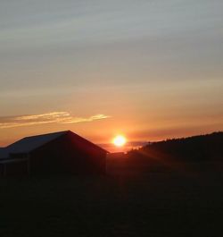 Scenic view of silhouette mountains against sky during sunset