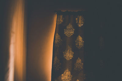 Close-up of tree against orange sky