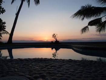 Scenic view of calm sea at sunset