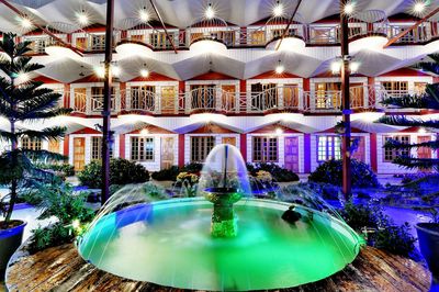 Reflection of illuminated buildings in water