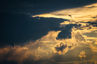 Low angle view of dramatic sky during sunset