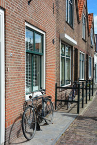 Typical holland - bicycles are on a house facade on zeeland in the netherlands