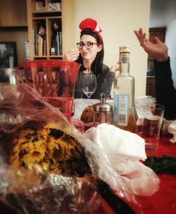 Young woman with drink in glass