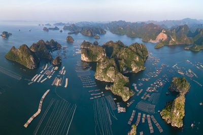 High angle view of rocks in sea against sky