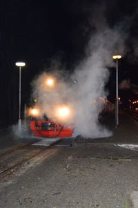 Cars on road at night during winter