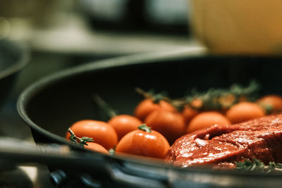 Close-up of fruits on cutting board in kitchen