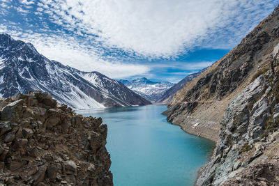 Scenic view of lake and mountains against sky