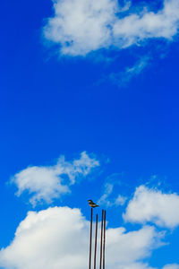 Low angle view of windmill against sky