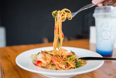 Close-up of person preparing food on table