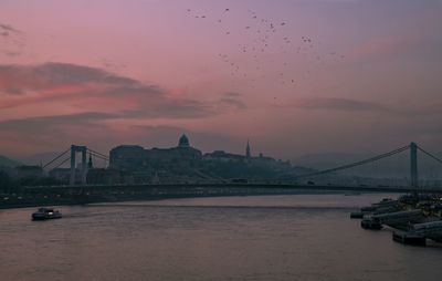 View of suspension bridge at sunset