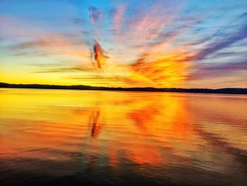 Scenic view of sea against romantic sky at sunset