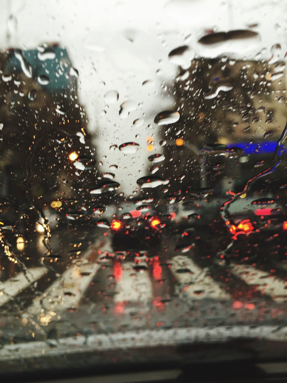 wet, drop, rain, window, transparent, glass - material, car, transportation, water, land vehicle, mode of transport, indoors, raindrop, season, weather, vehicle interior, windshield, car interior, road, glass