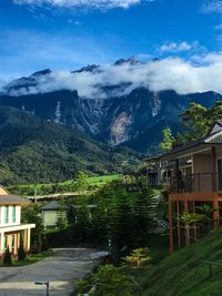 Mountain range against cloudy sky