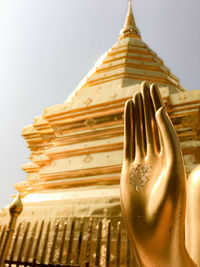 Low angle view of statue against building